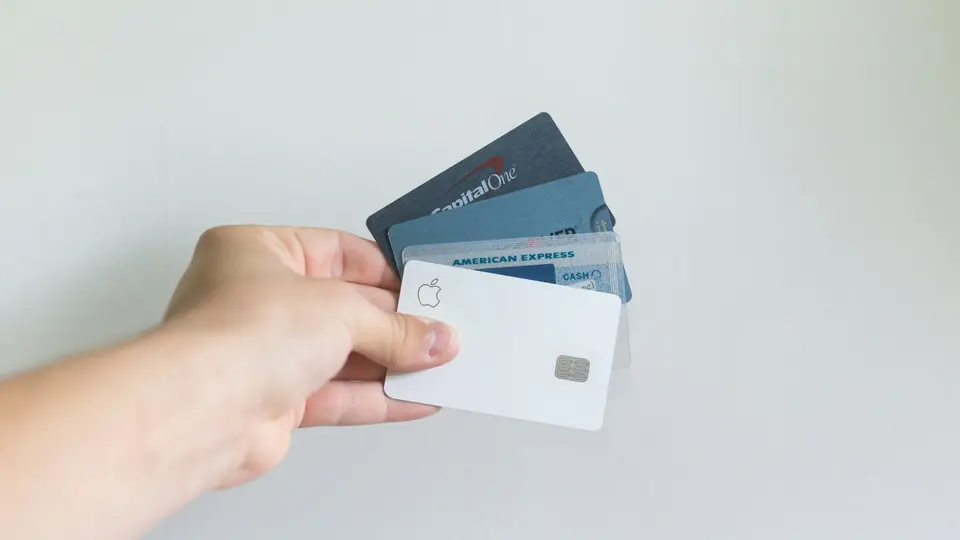 a single bank card resting on a plain surface